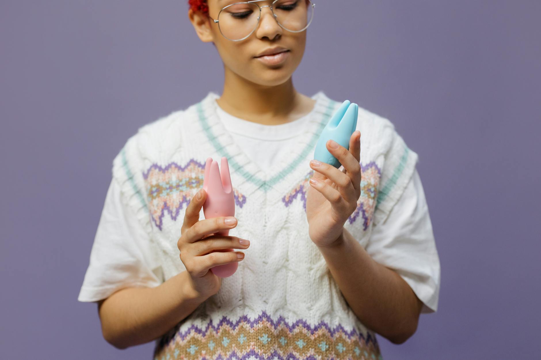 Woman holding lemon clitoral vibrators while contemplating intimacy and recovery.